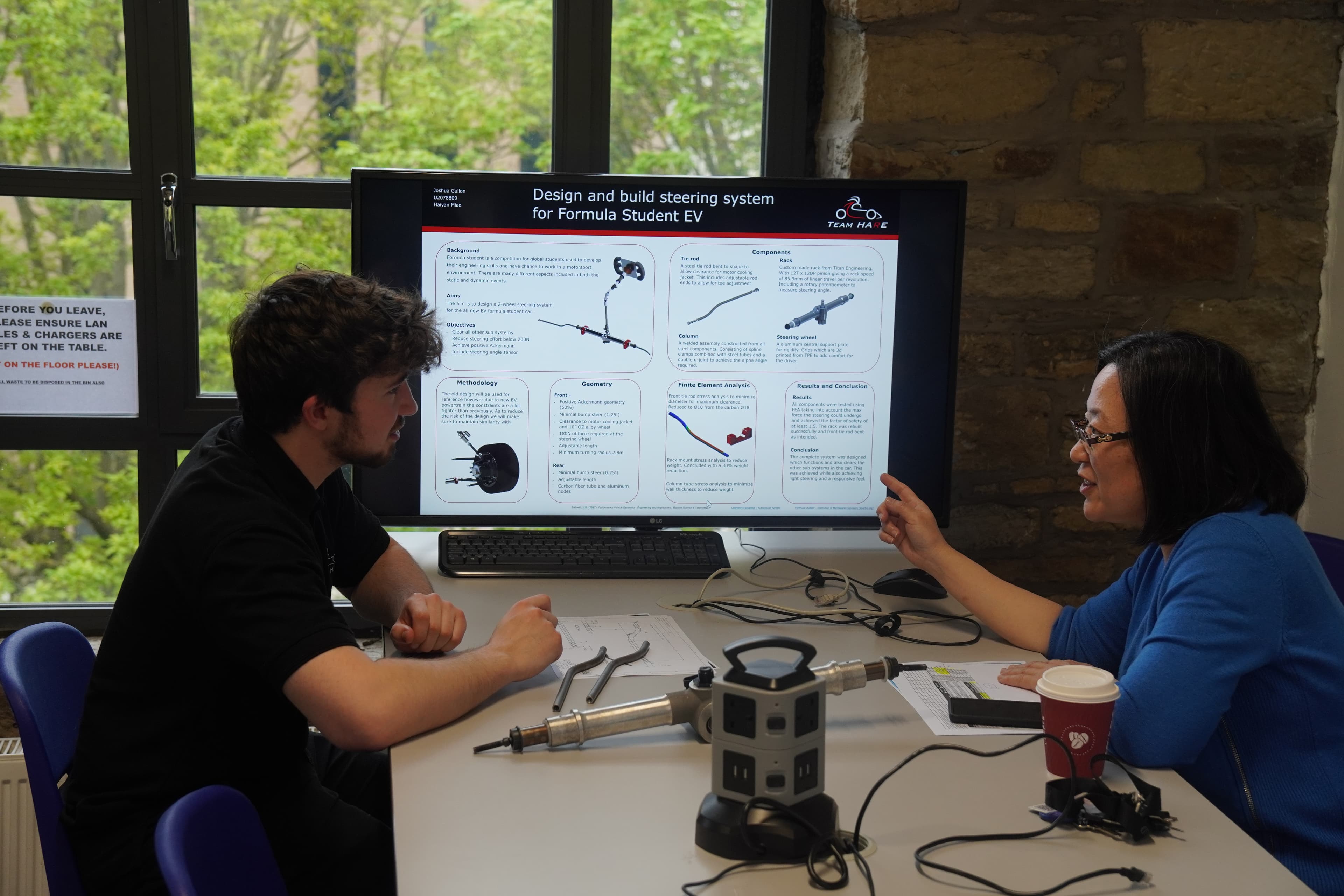 Student and industry professional discussing a project