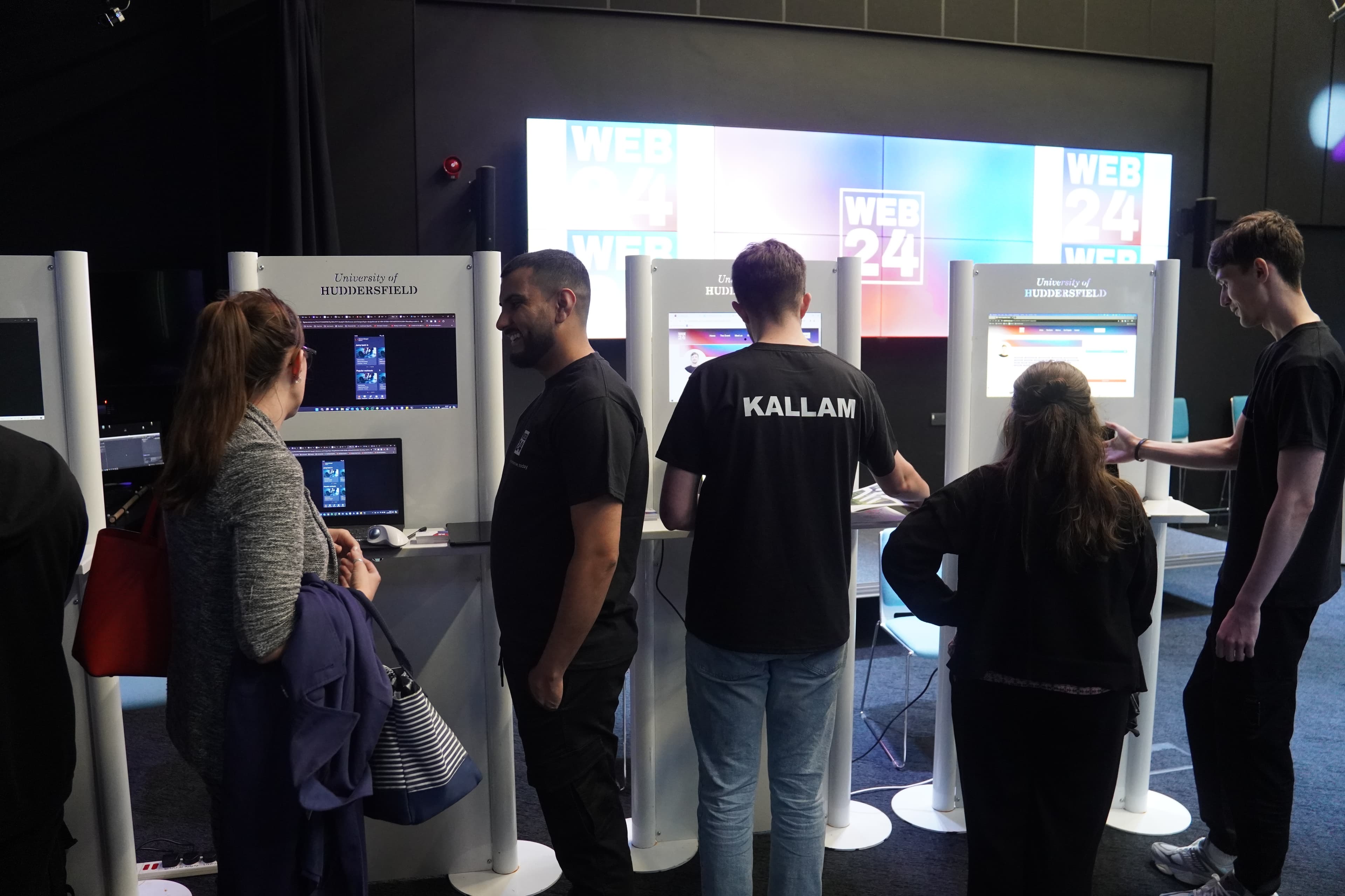 Students at showcase kiosks